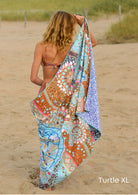 Beach towel from Soobluu made of recycled plastic. The design is a turtle drawing. 