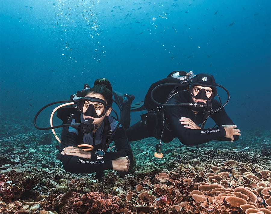 Two scuba diver in Fourth Element Scuba Dive gear adn wetsuits 