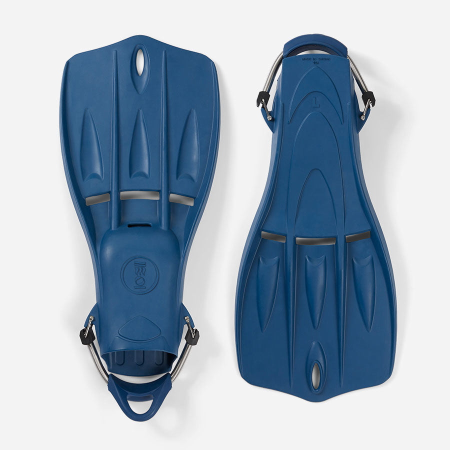 A pair of blue Tech Fins designed for scuba diving, featuring a vented blade and spring straps.